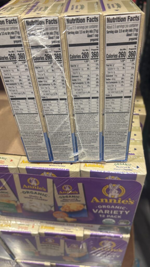 Nutrition facts panel on Annieās Organic Mac and Cheese boxes showing both dry mix and prepared values. Each serving (prepared) has 360 calories, 9g protein, 3g total fat, and 50g carbs.